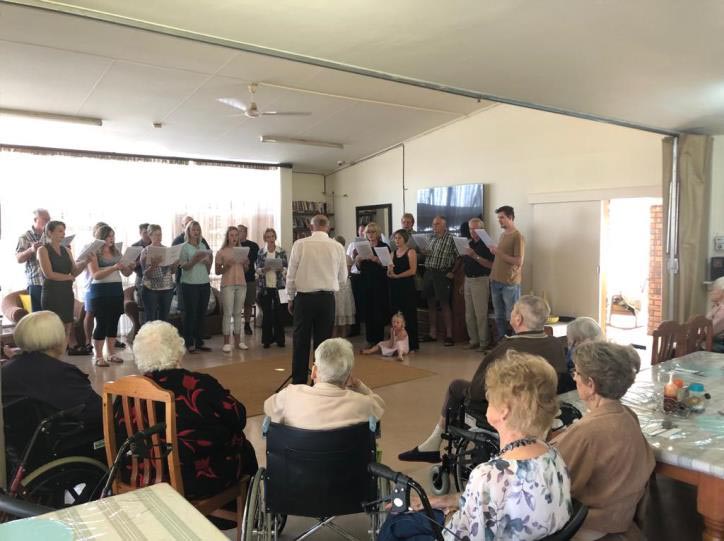 People singing in an old-age home